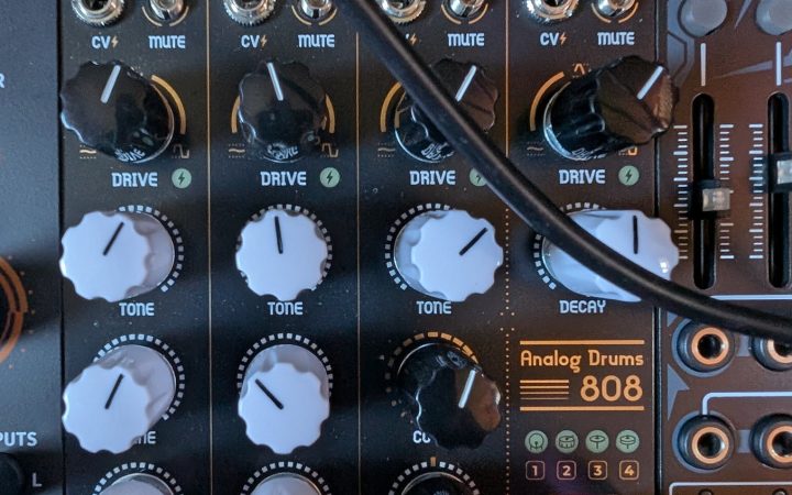 NANO Modules OCTA Eurorack drum module patched in a rack, showing kick, snare and hat voices with drive, tone and decay controls